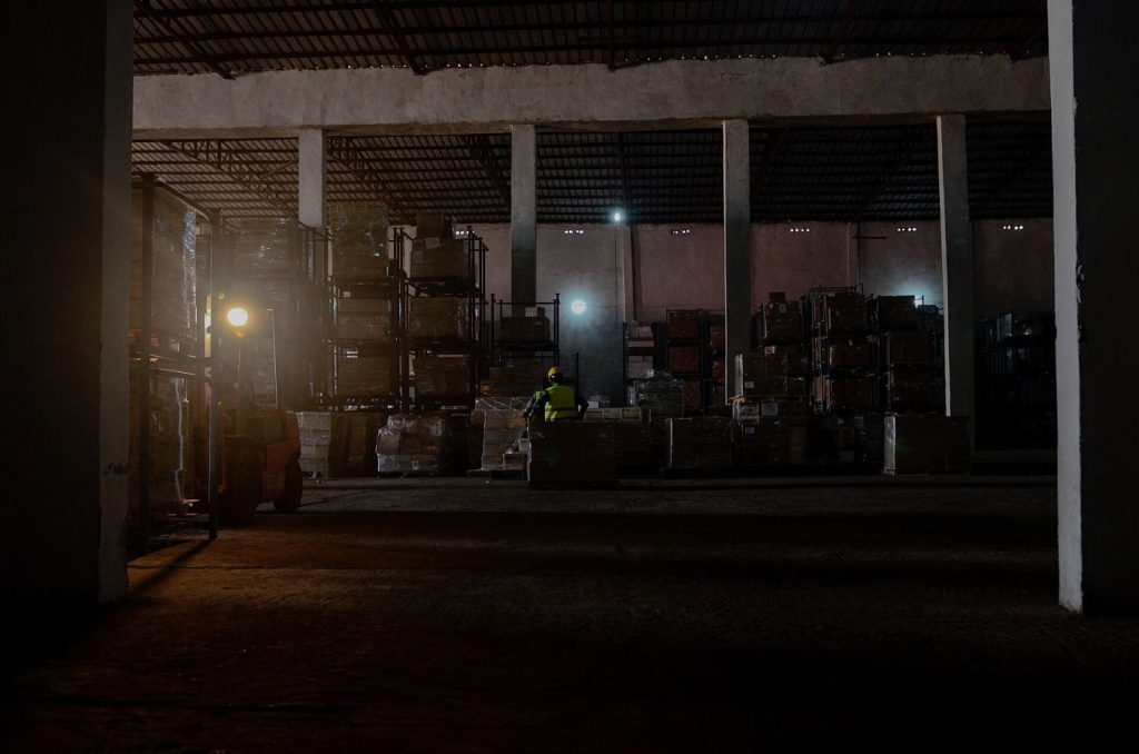 A warehouse with tall shelving