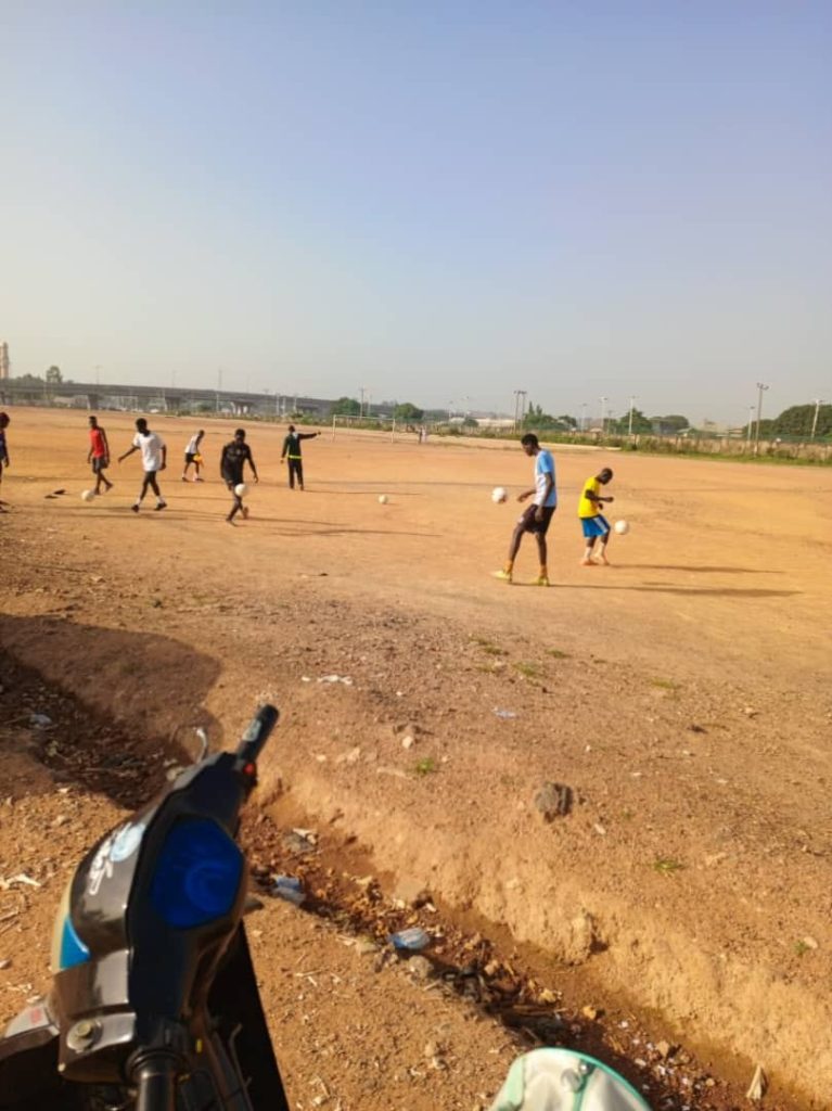 Coaches’ Feedback Style Decides Whether Teenagers Stay in Sport young footballers training on a field